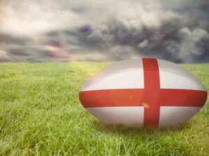england rubgy ball on grass moody sky background