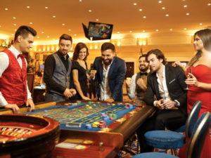 friends playing roulette together social gambling