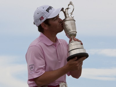 golfer winning the open holding claret jug