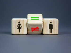 man and woman blocks with equal and unequal block between them