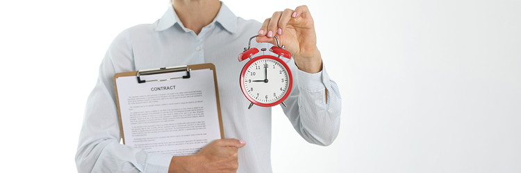 man holding contract and clock