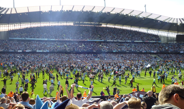 pitch invasion at the etihad manchester city fans