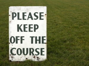 please keep of the course sign at racecourse