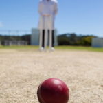 umpire stood over a cricket ball